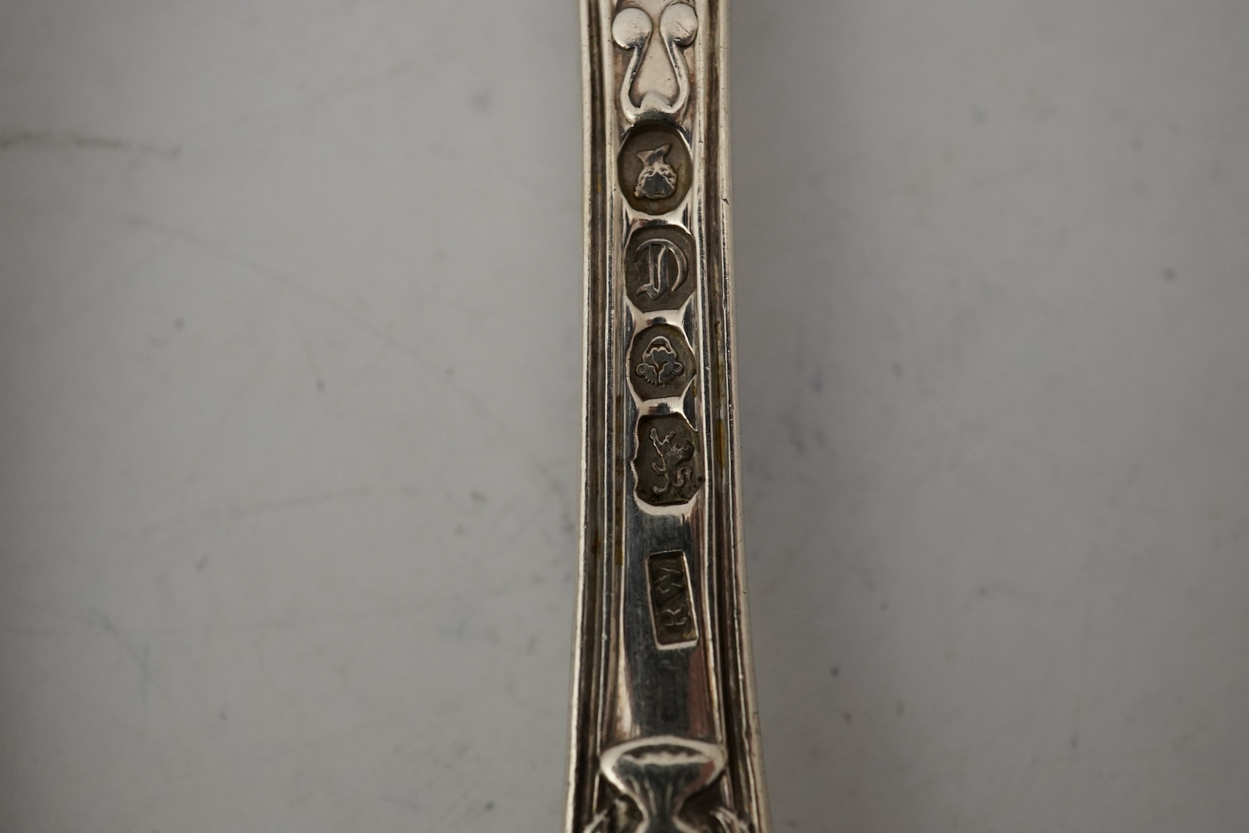 A part canteen of early Victorian silver flatware, by Robert Wallis, double struck with an unusual pattern with entwined cornucopia and a raised star terminal